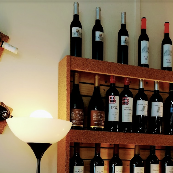 Wine bottles in and on a cork rack